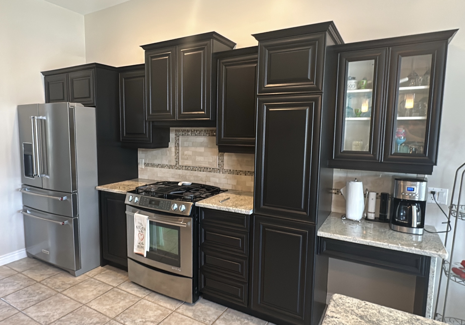 Charcoal kitchen cabinets after refinishing from the matching angle