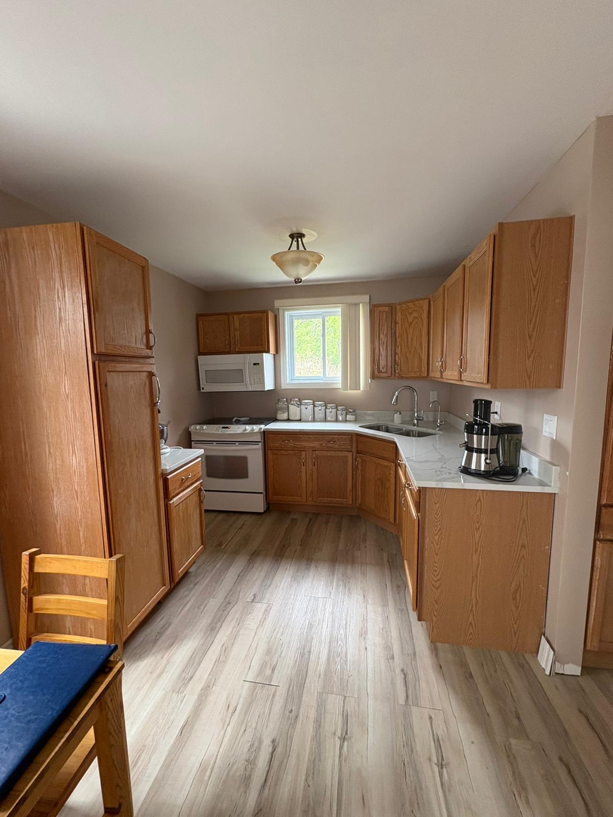 Oak kitchen cabinets before blue refinishing