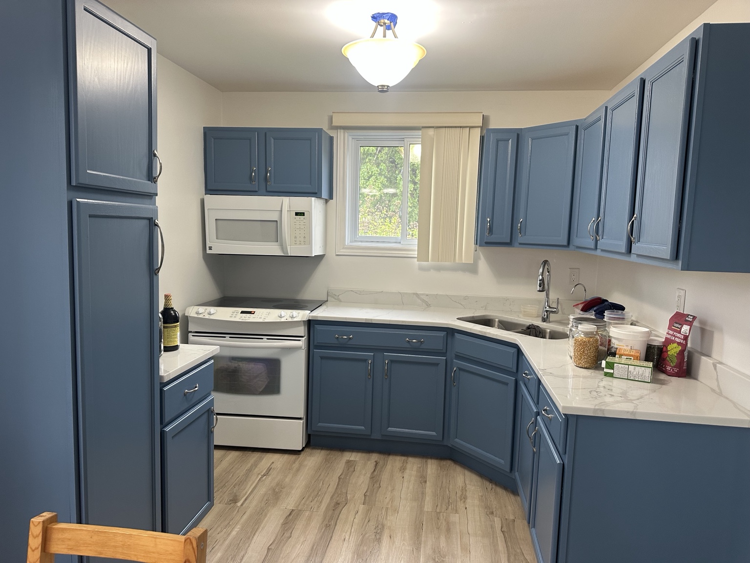 Blue kitchen cabinets after refinishing