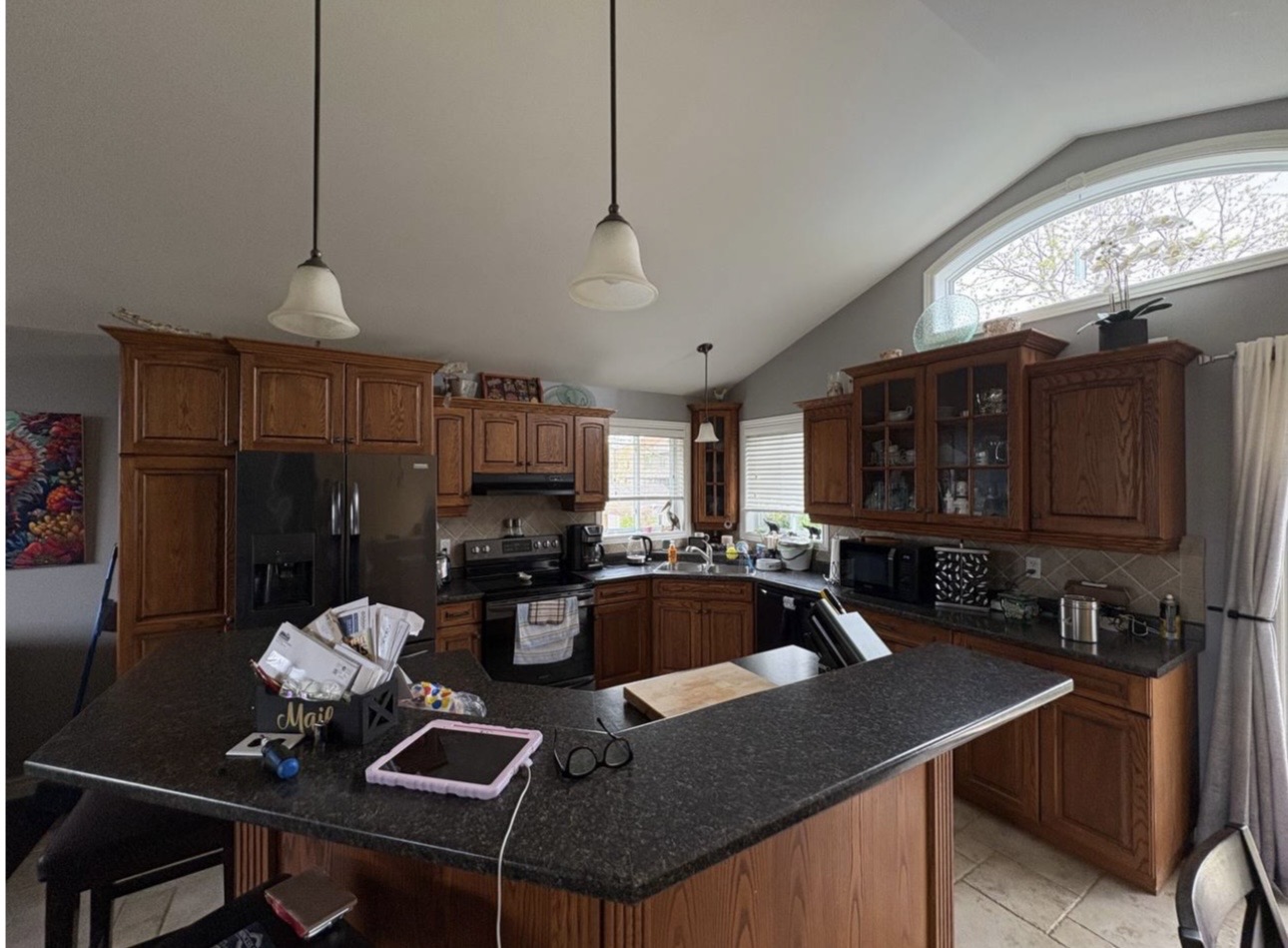 Brown kitchen before grey cabinet refinishing
