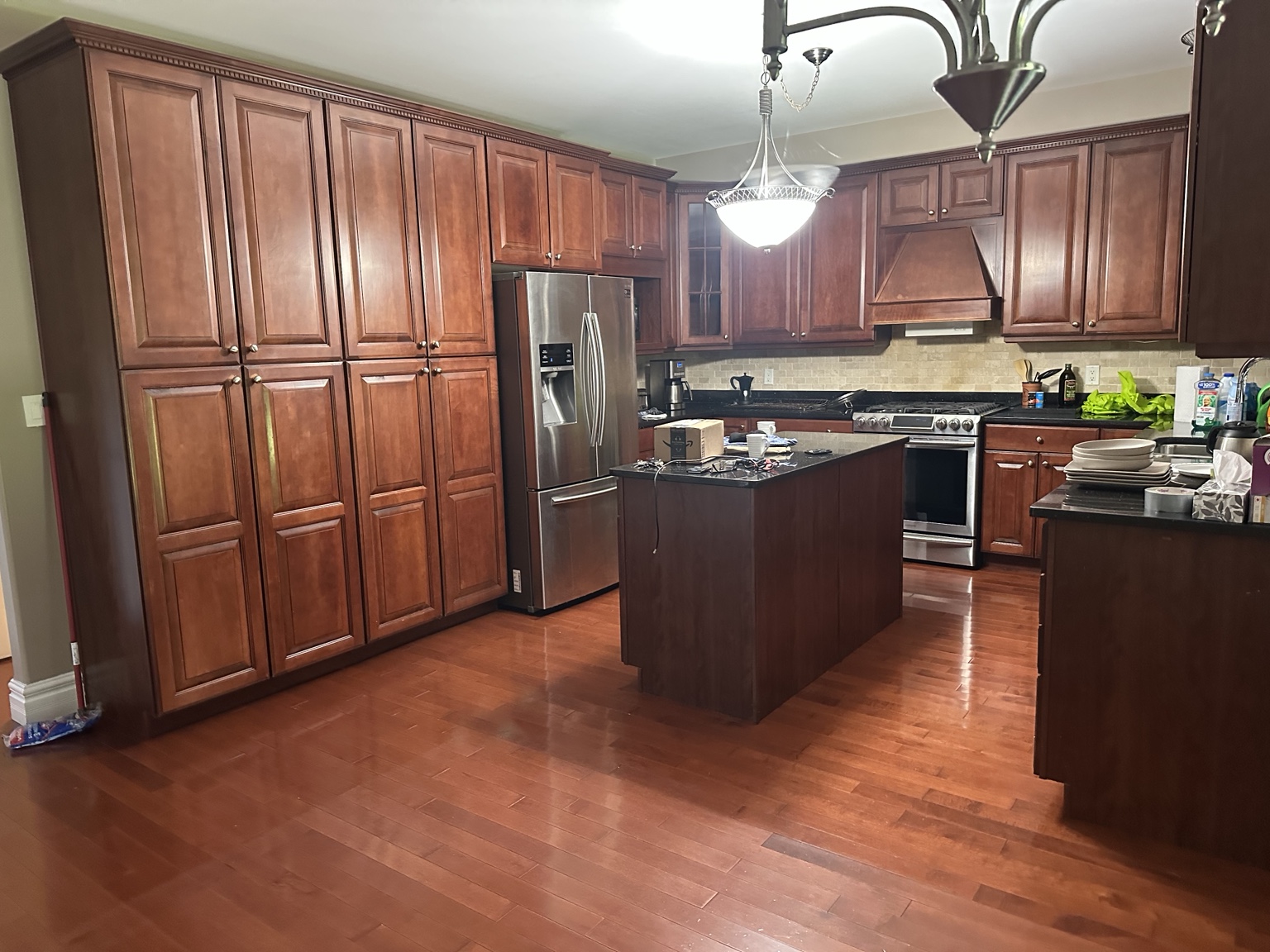 Wood kitchen cabinets before white refinishing