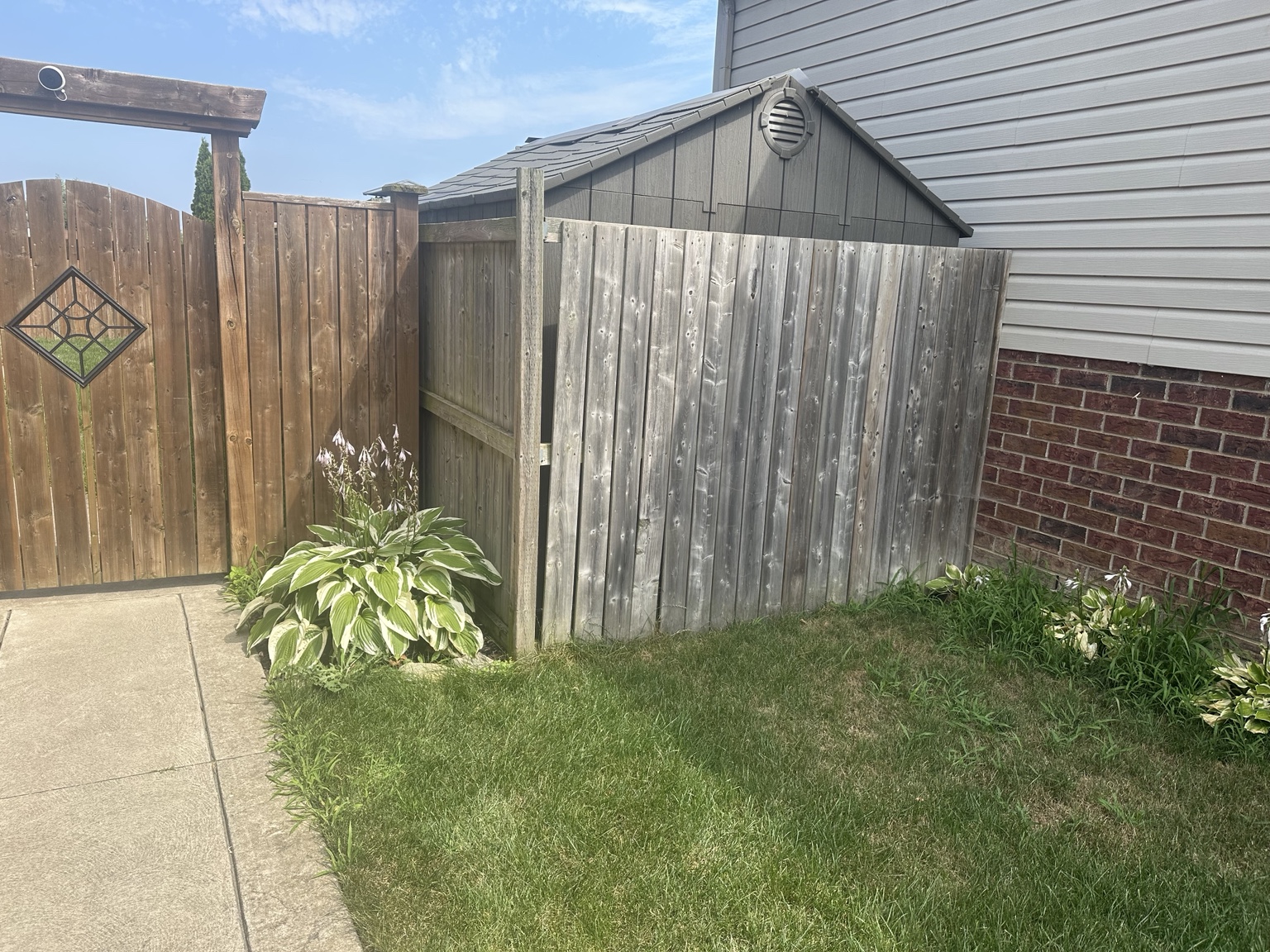 Weathered fence gate before staining