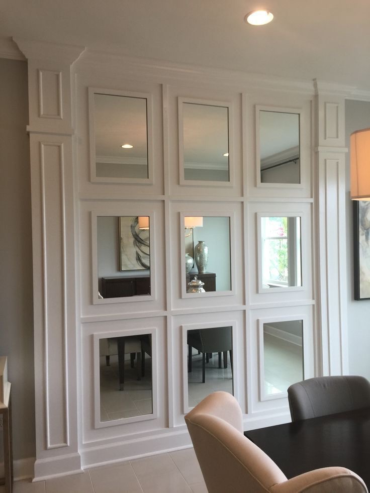 White custom wall moulding around windows