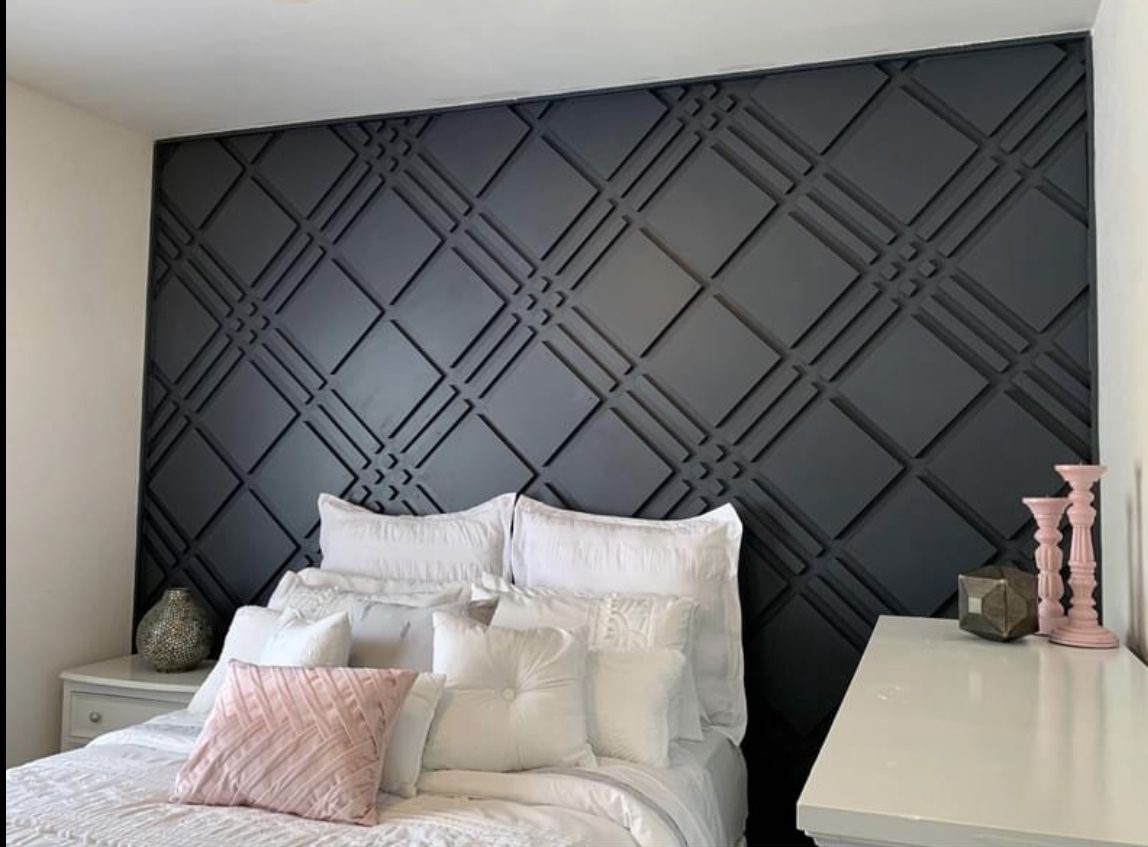 Black geometric bedroom feature wall