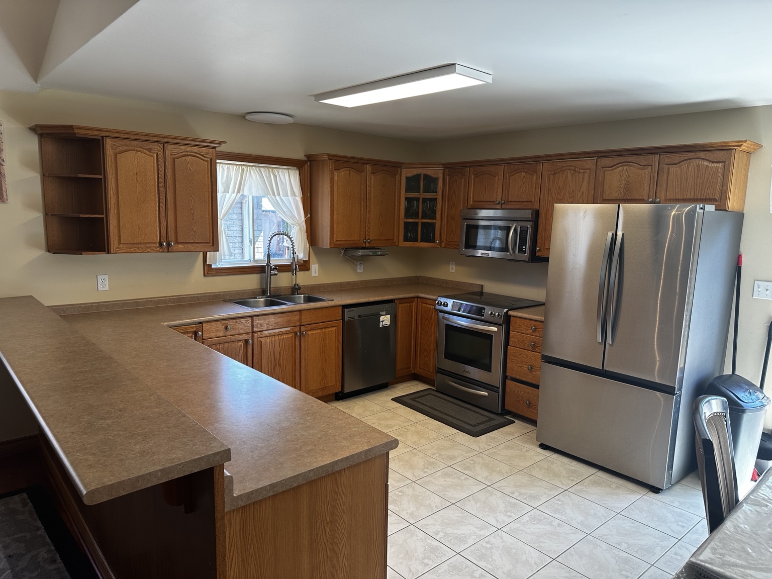 Wood kitchen with island before refinishing