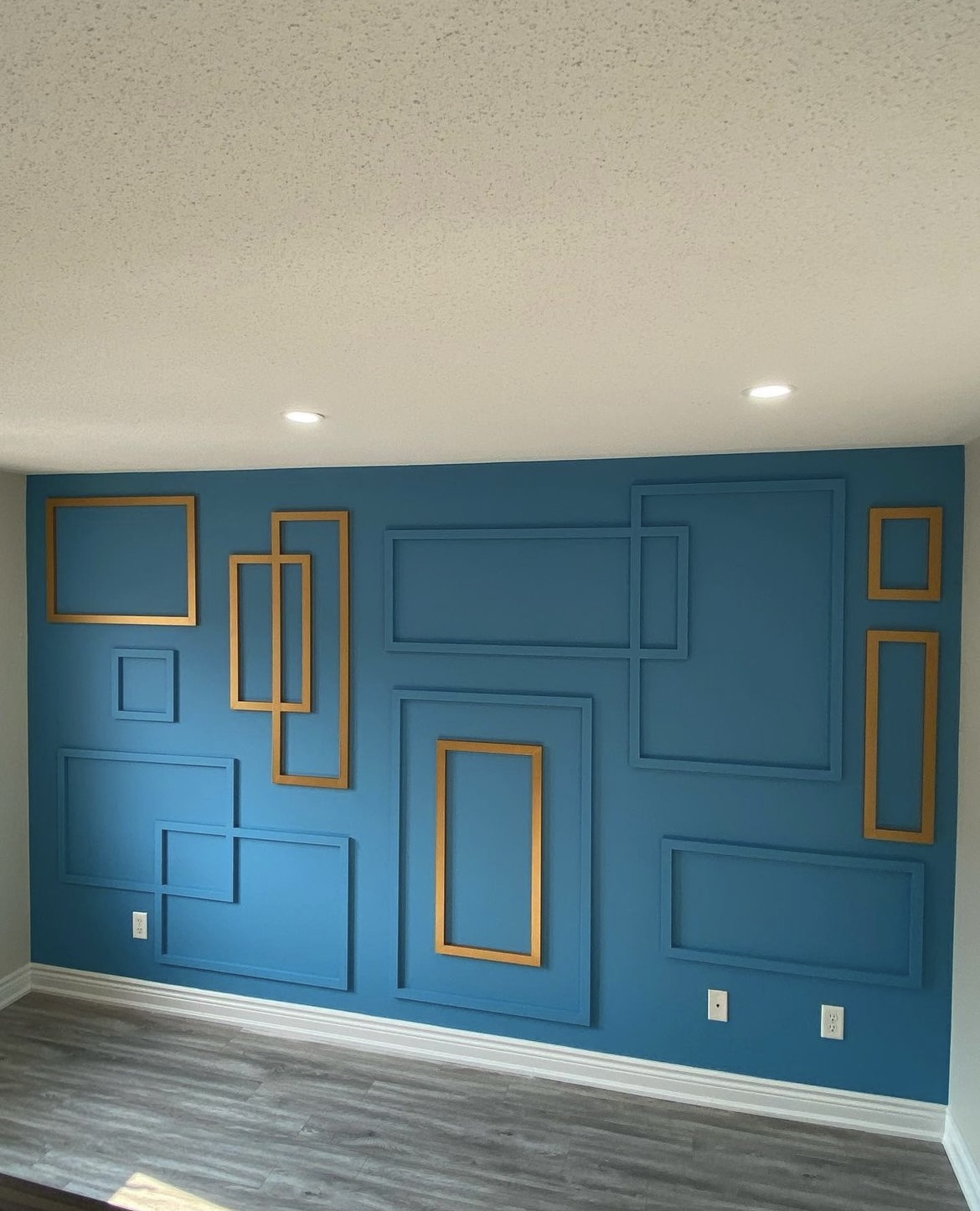 Blue picture-frame moulding with gold accents