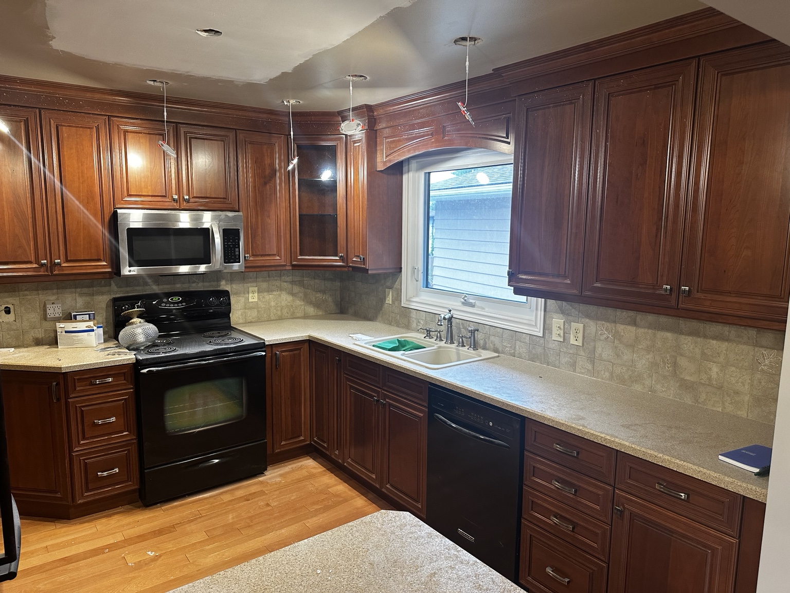 Dark detailed kitchen cabinets before refinishing