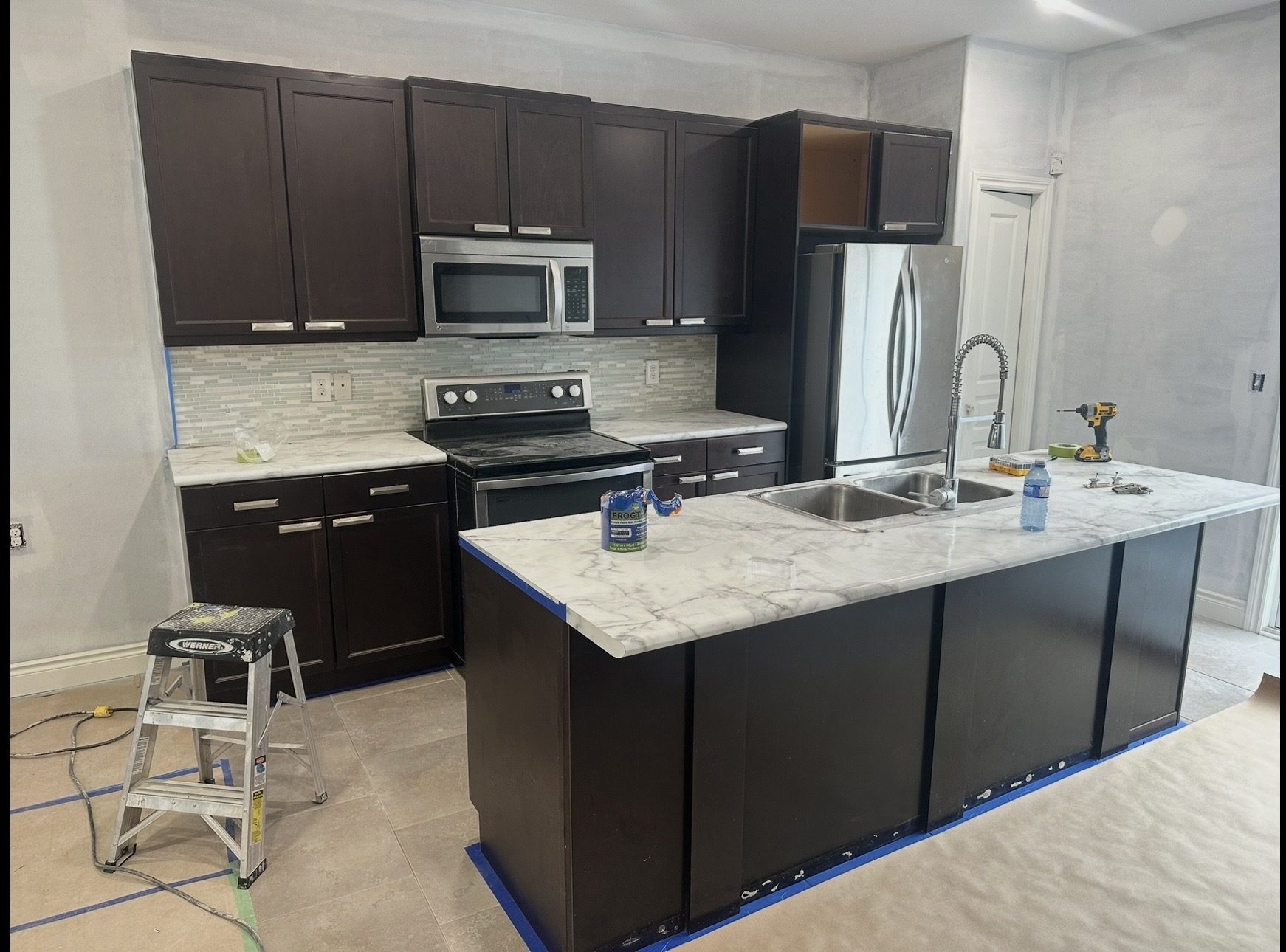 Dark kitchen cabinets before two-tone refinishing