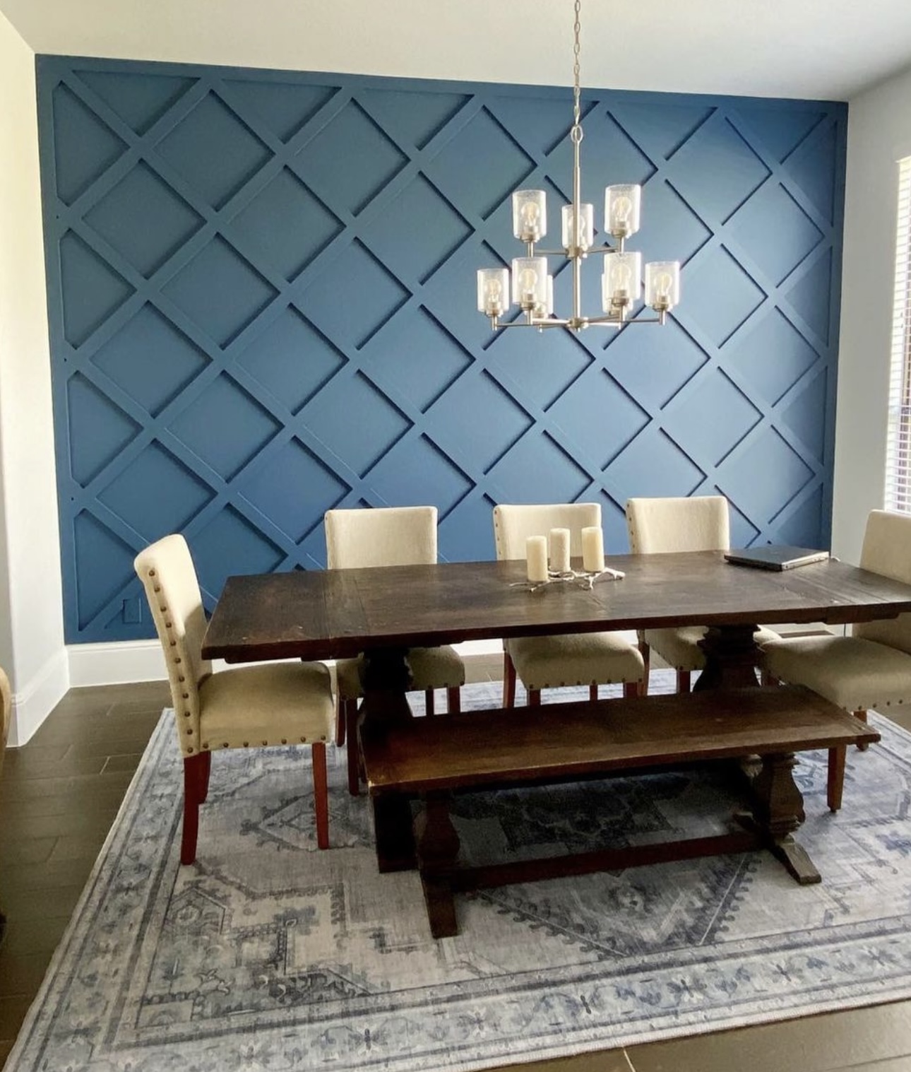 Blue custom geometric feature wall in a dining room